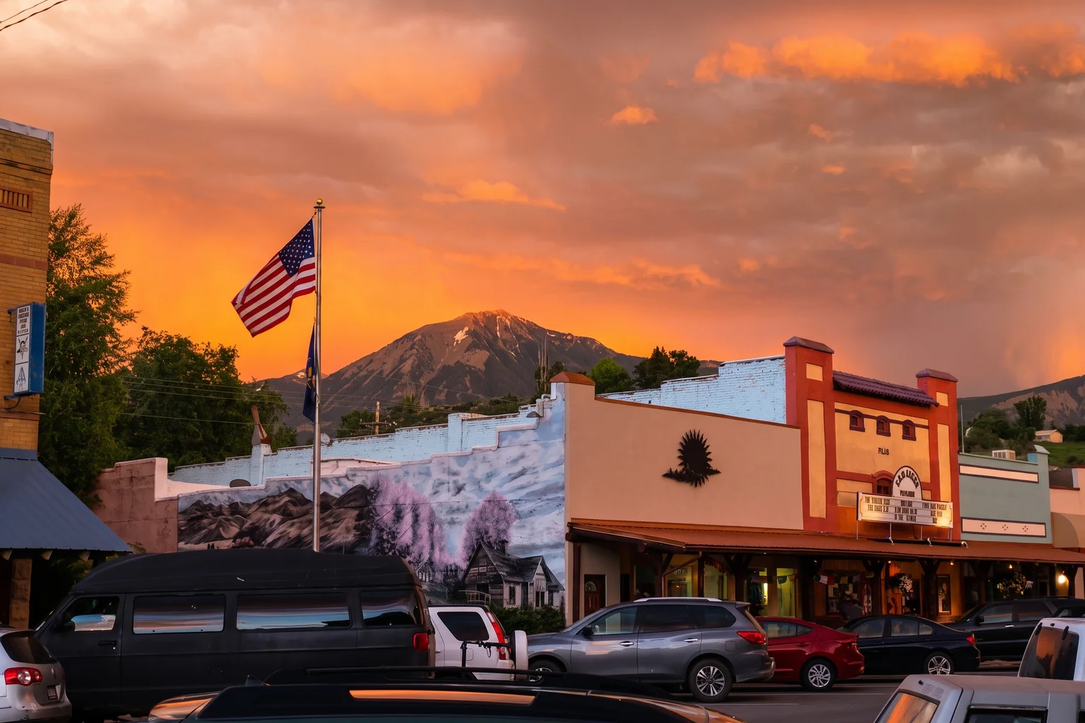 Mount Lamborn above downtown Paonia beneath a vivid orange sunset