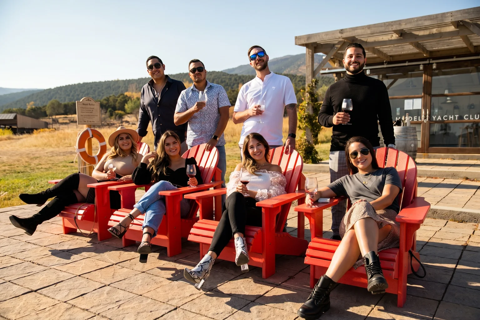 Friends enjoying wine together outside a Western Colorado tasting room
