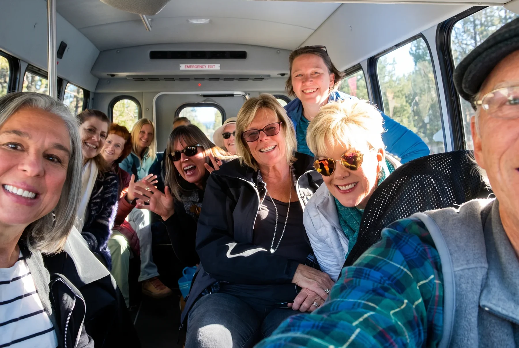 Friends smiling together during a group outing inside Hoss