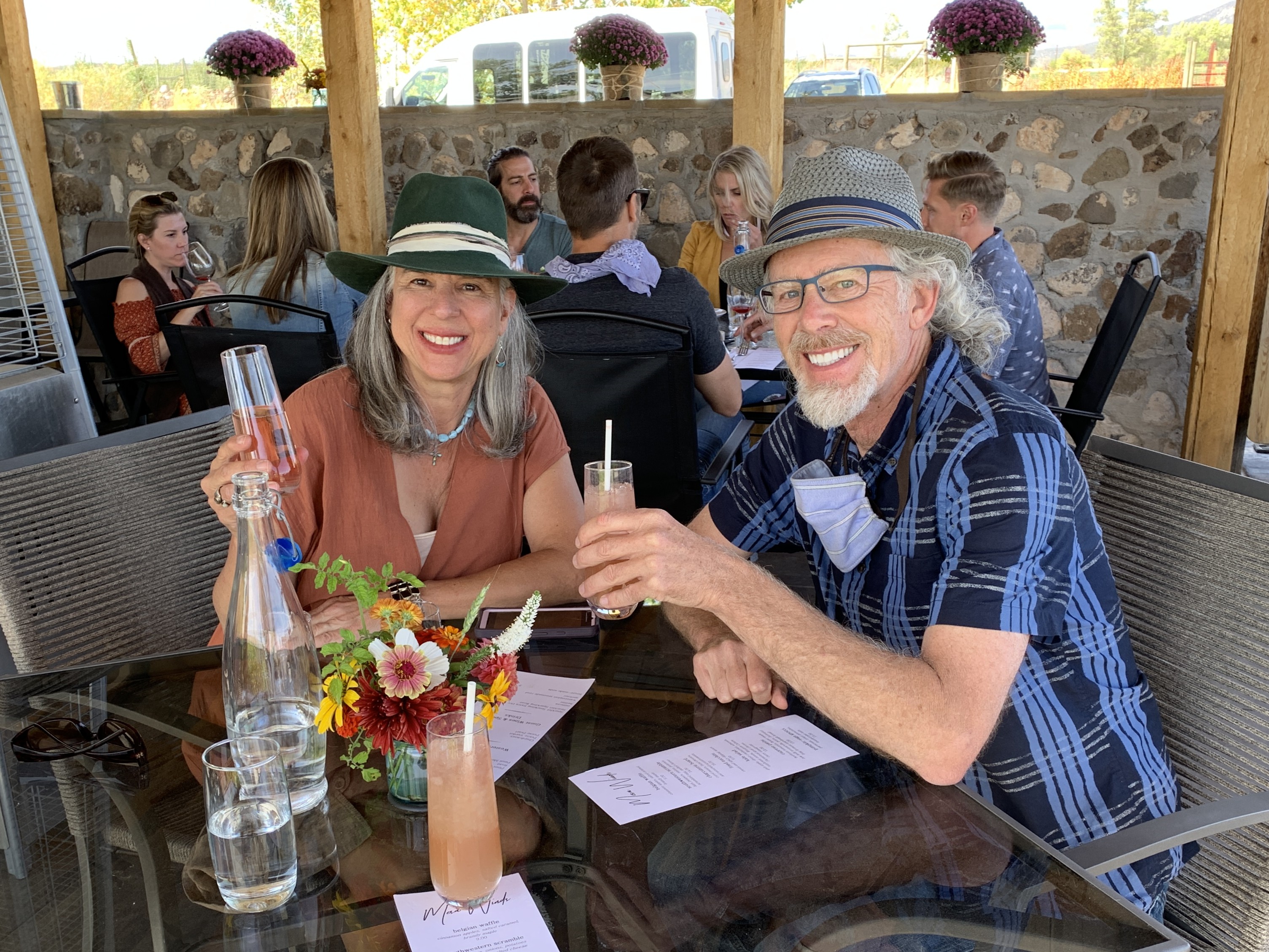 Jo Ann Jarreau and Dave Noe smiling together at a wine dinner